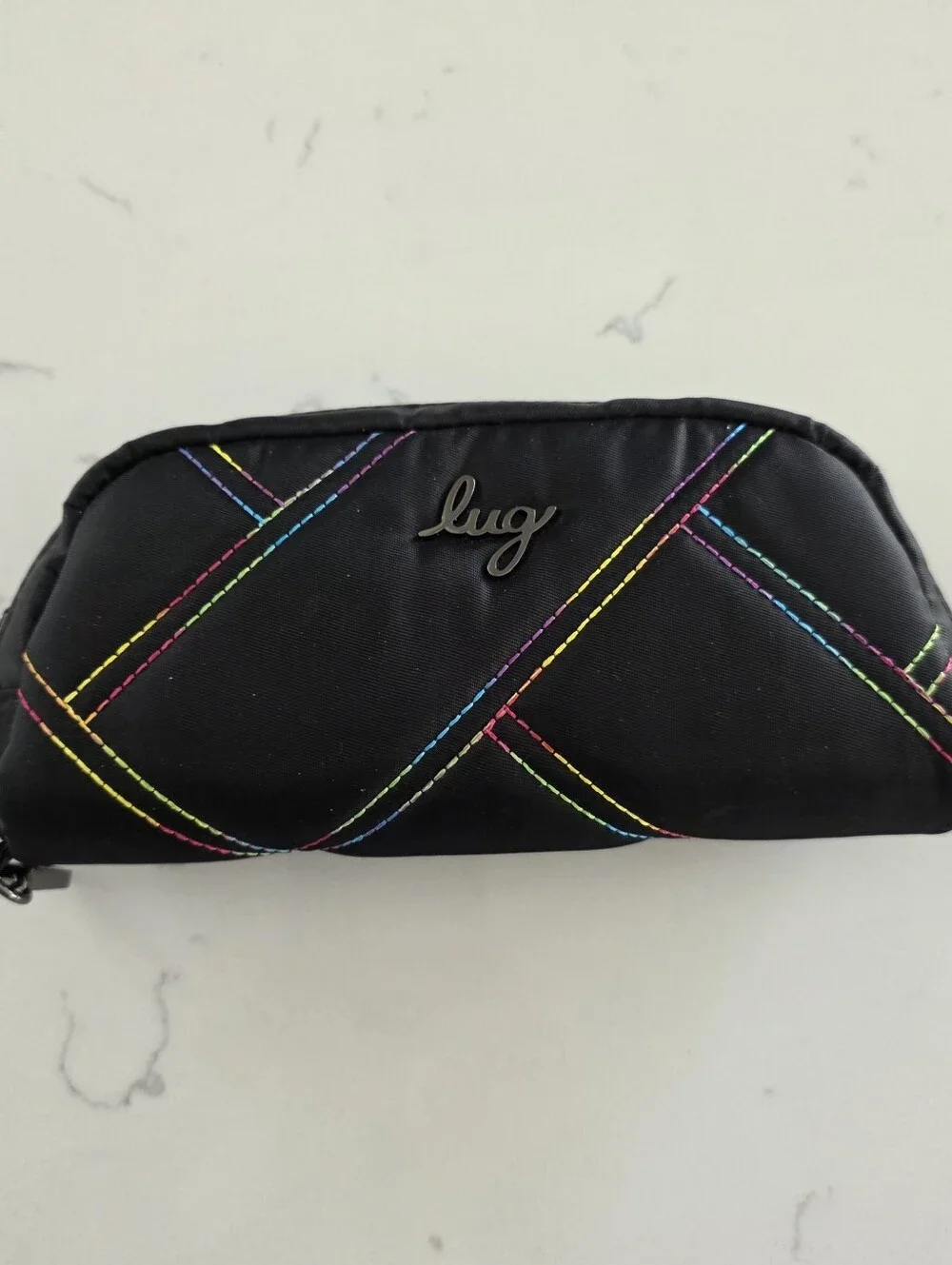 Lug Bob sled glasses case with rainbow stitching.